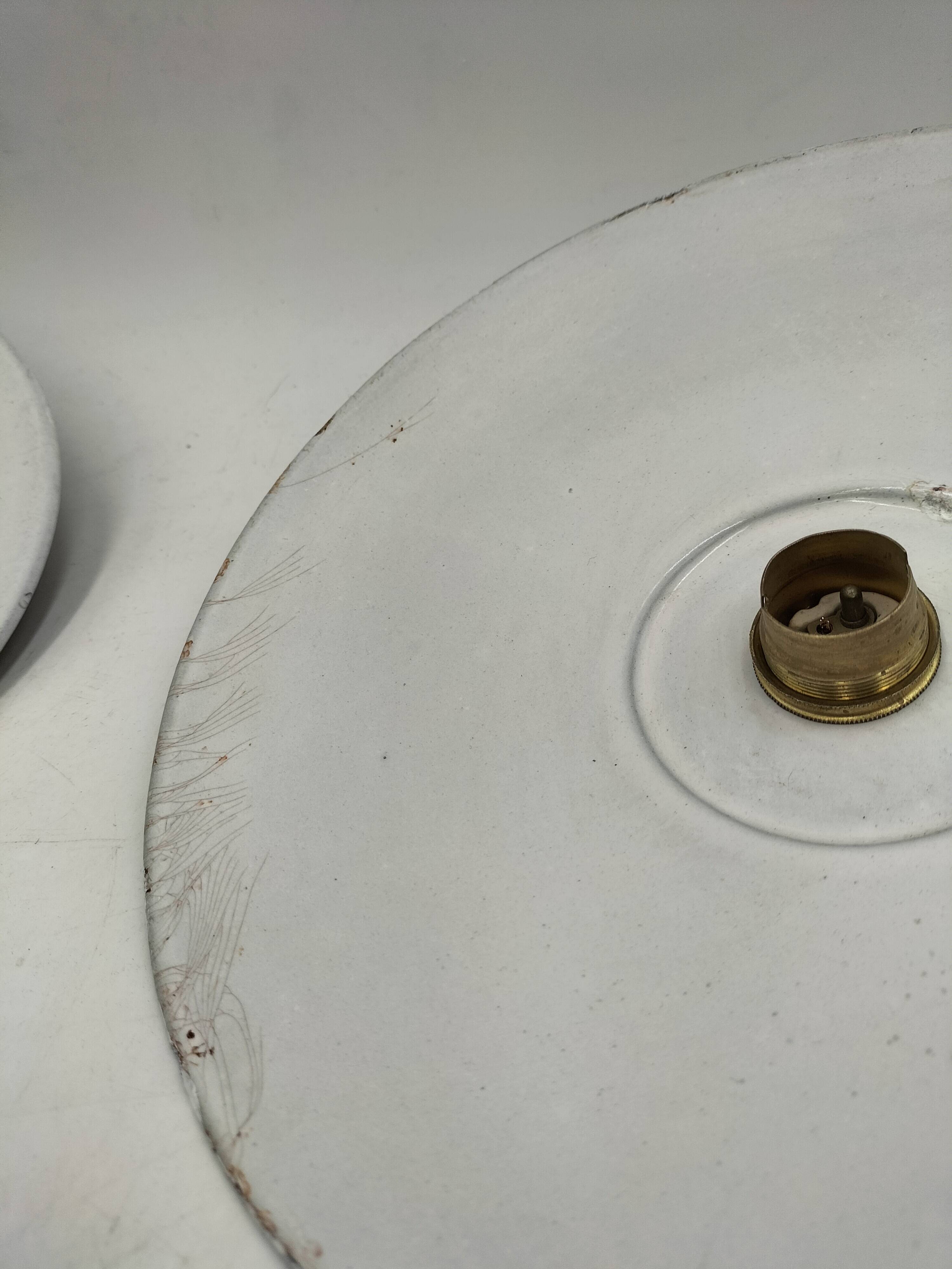 Three enamelled sheet metal suspensions