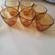 Service of 6 cups and saucers in amber glass.