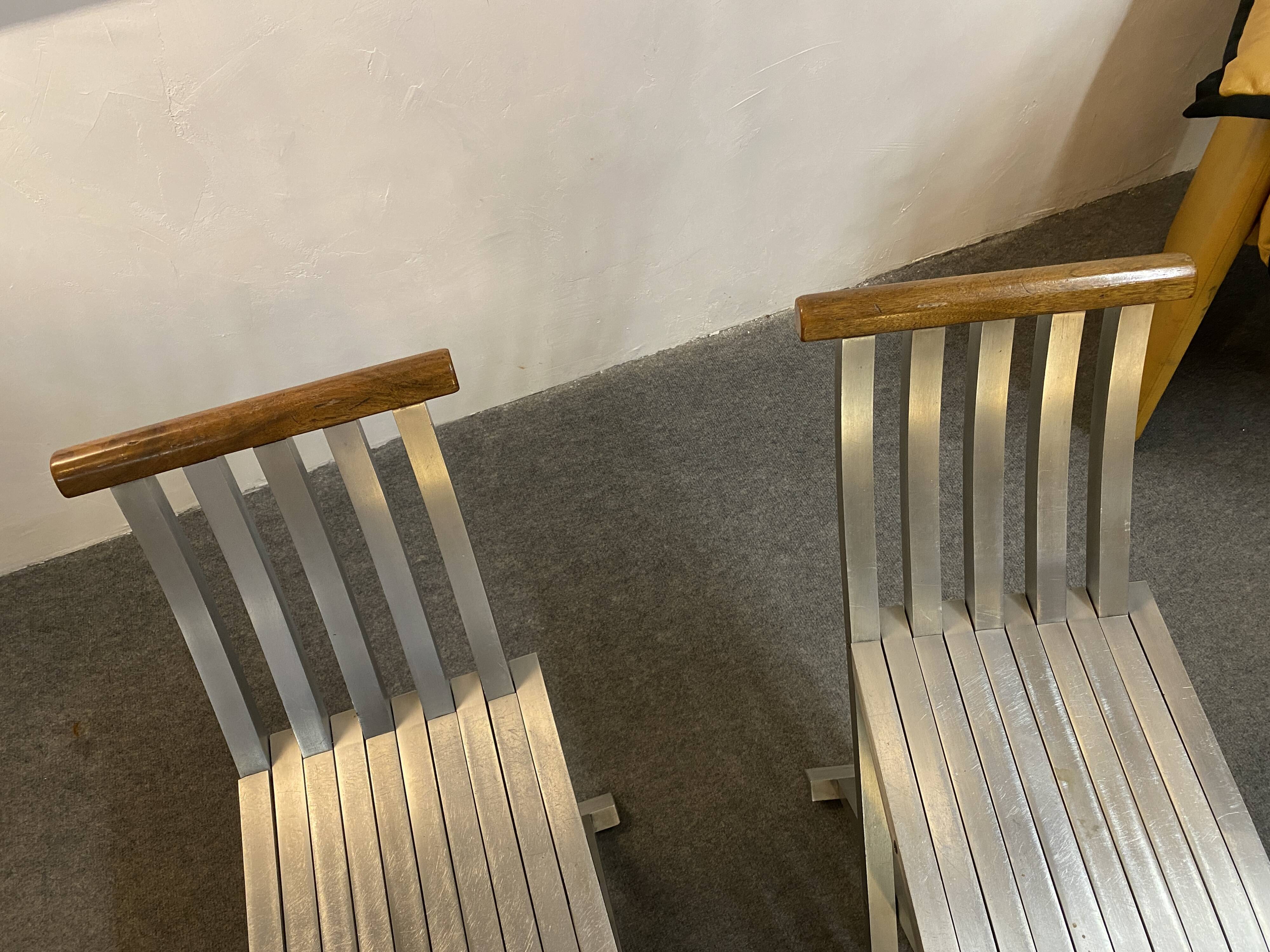 Pair of curule chairs designed by John Vesey, 1958, USA, brushed aluminum, walnut and leather
