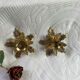 Pair of candlesticks, holly leaves, in brass