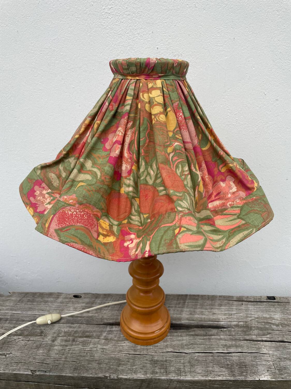Turned wood lamp with flower shade
