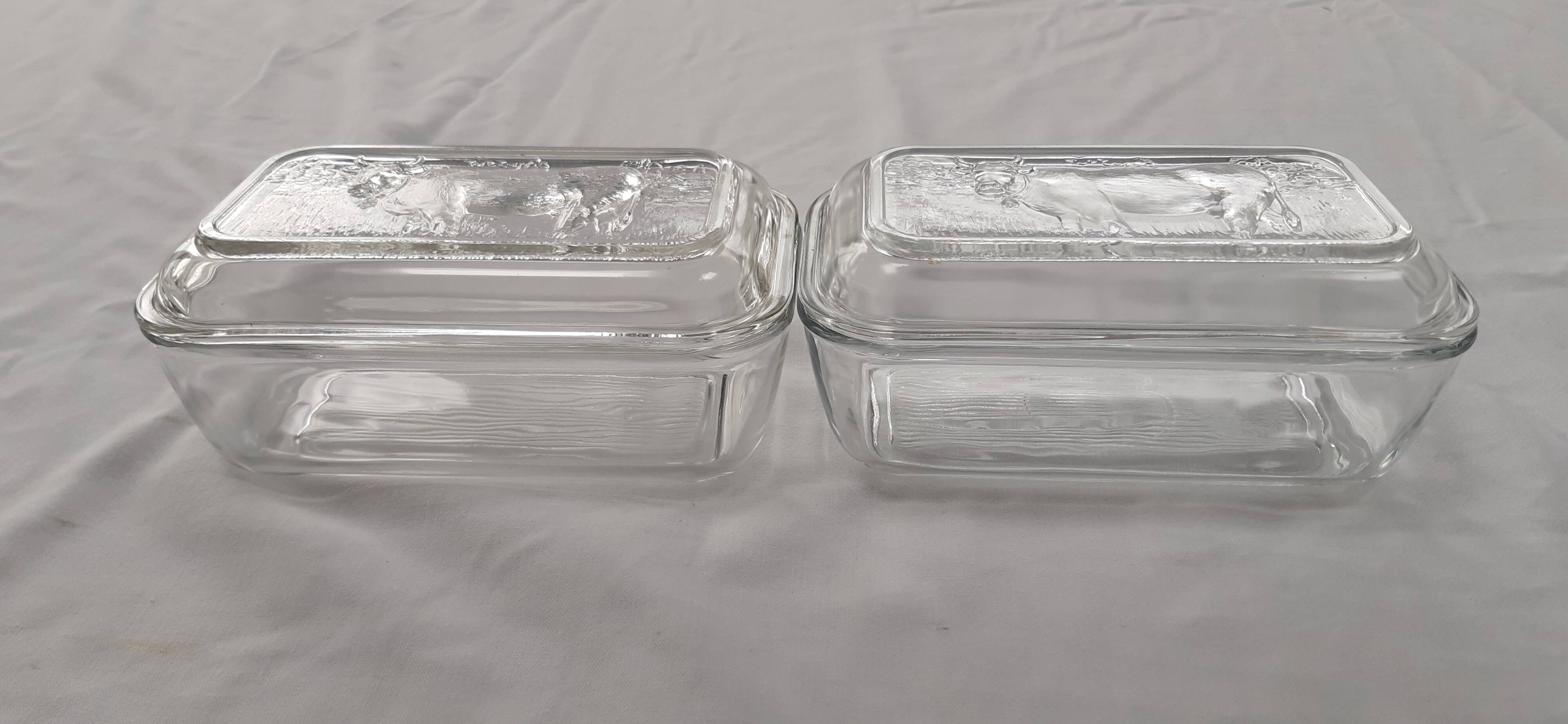 Two Arcoroc glass dairy cow butter dishes