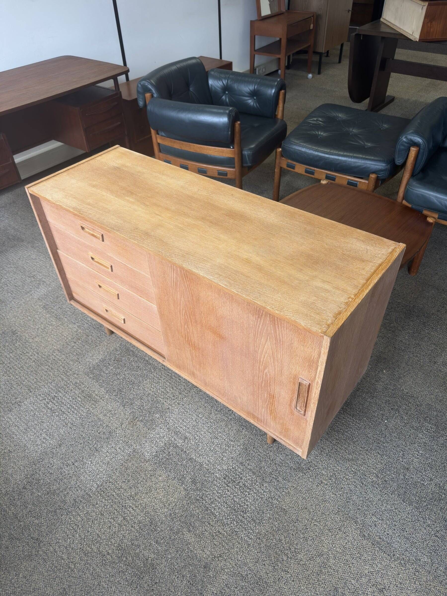 Danish buffet in light oak with sliding door and four drawers.