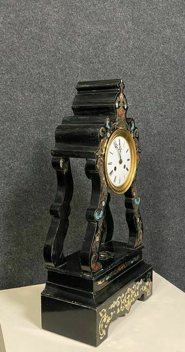 Portico clock of eventful shape of napoleon III period blackened wood inlaid with brass
