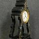 Portico clock of eventful shape of napoleon III period blackened wood inlaid with brass