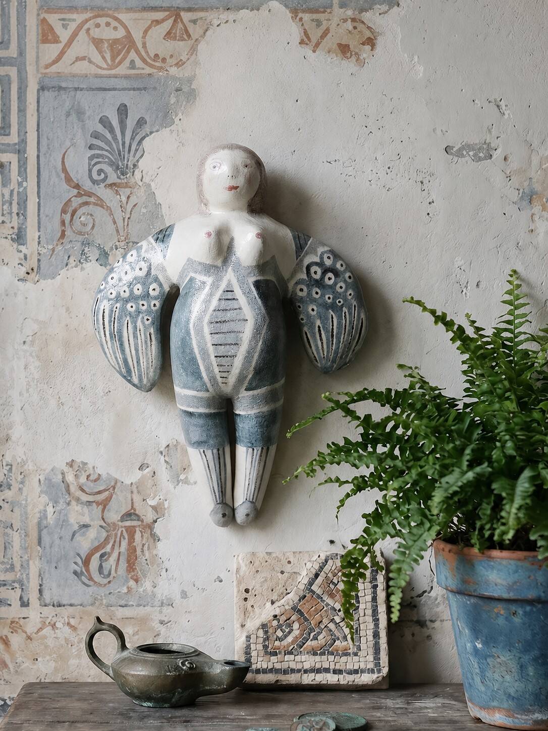 Vintage stylised mermaid ceramic wall sculpture from an art studio.