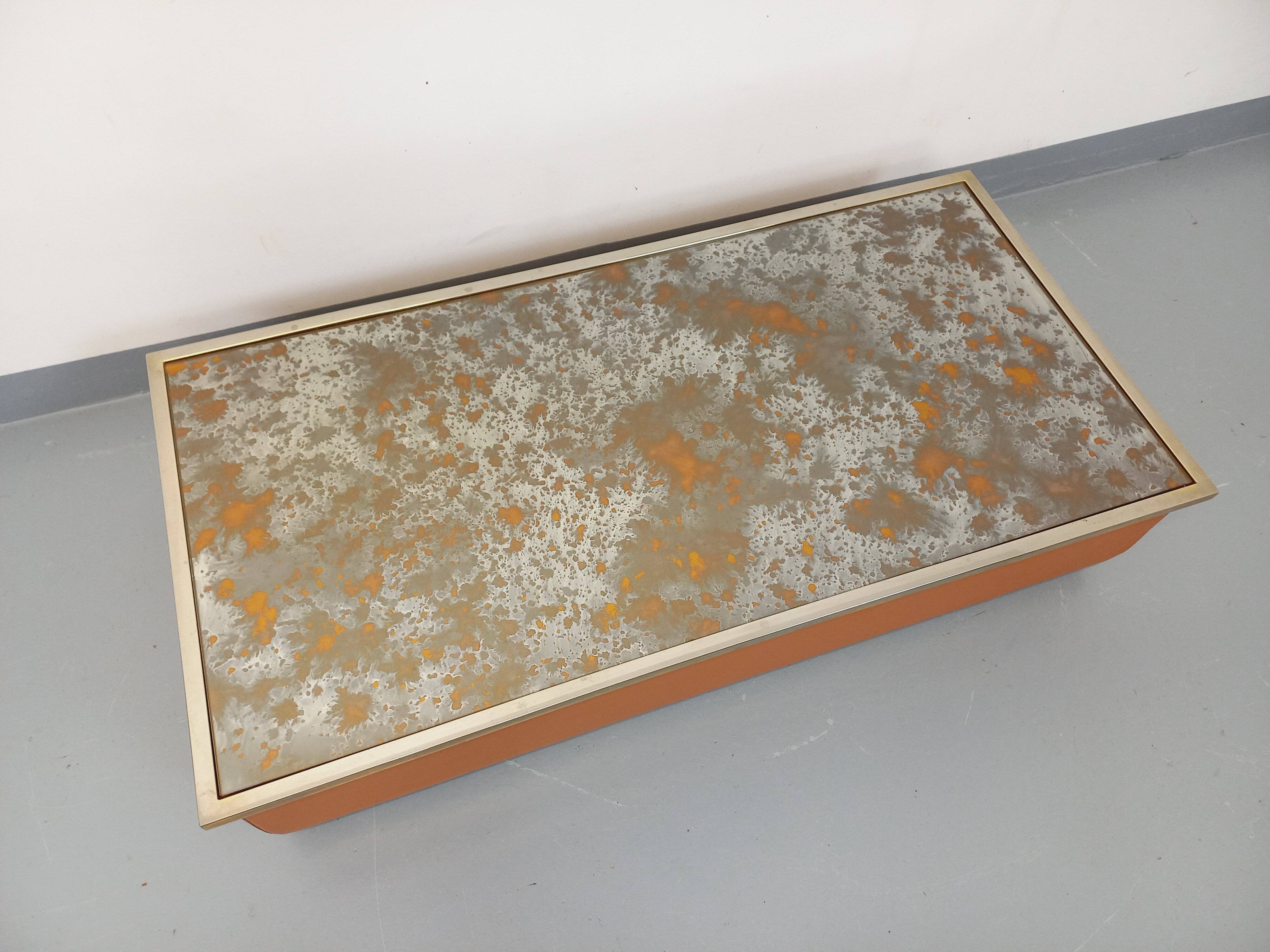 Vintage coffee table in églomisé glass, chrome and leather from the 70s