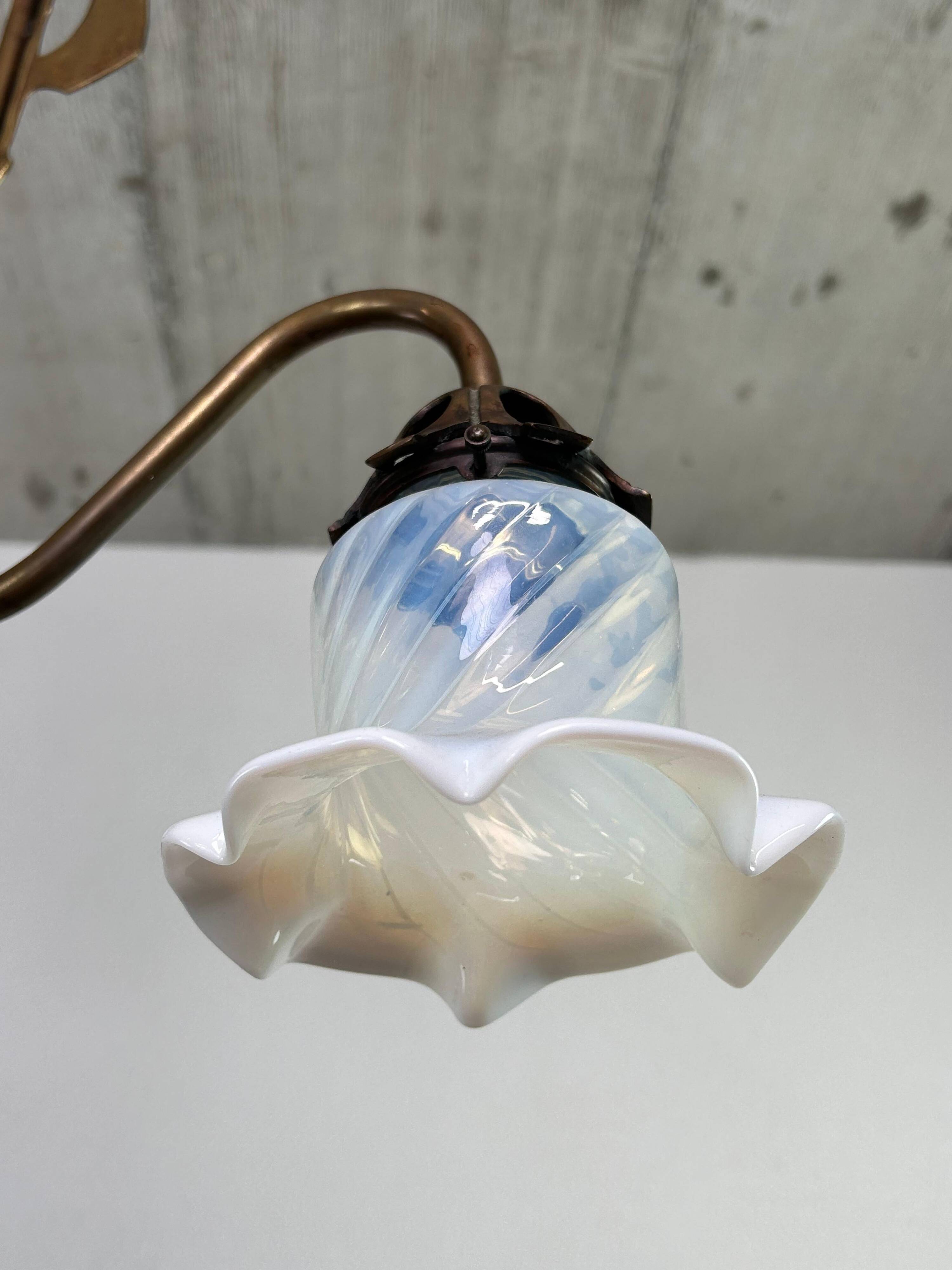 Art Nouveau chandelier with three arms and opalescent iridescent glass.