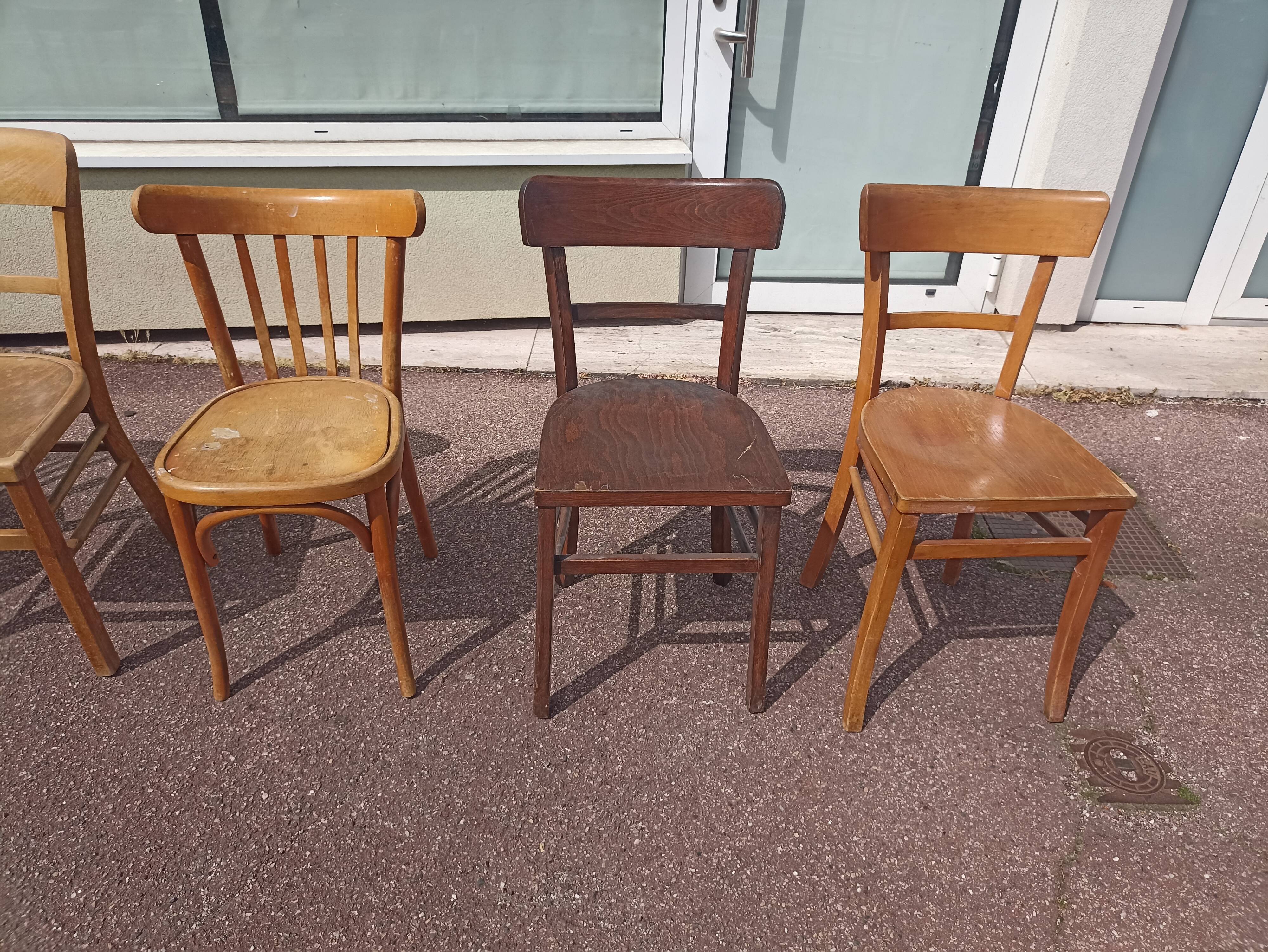 Set of 12 mismatched wooden bistro chairs