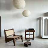 Reclined armchair in canned teak in natural wood