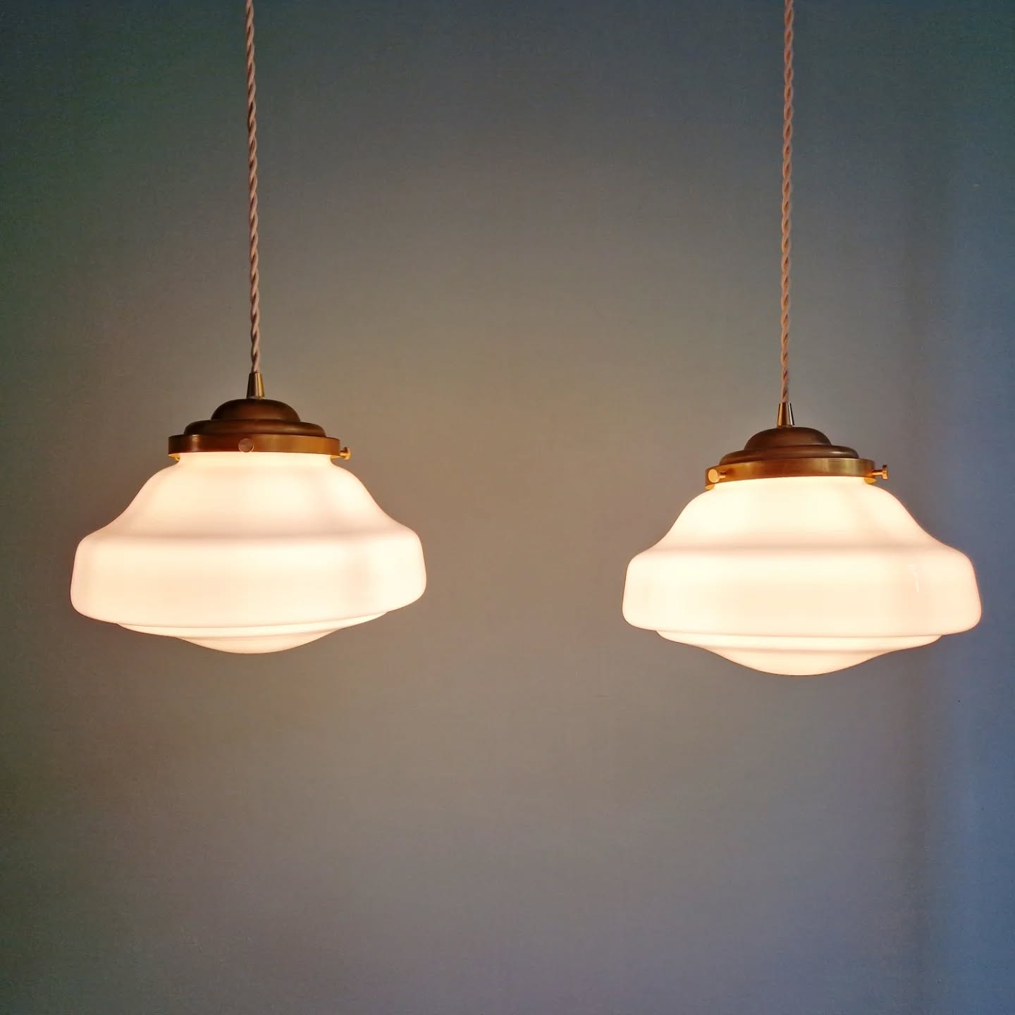 Pair of Art Deco pendant lights in white opaline.