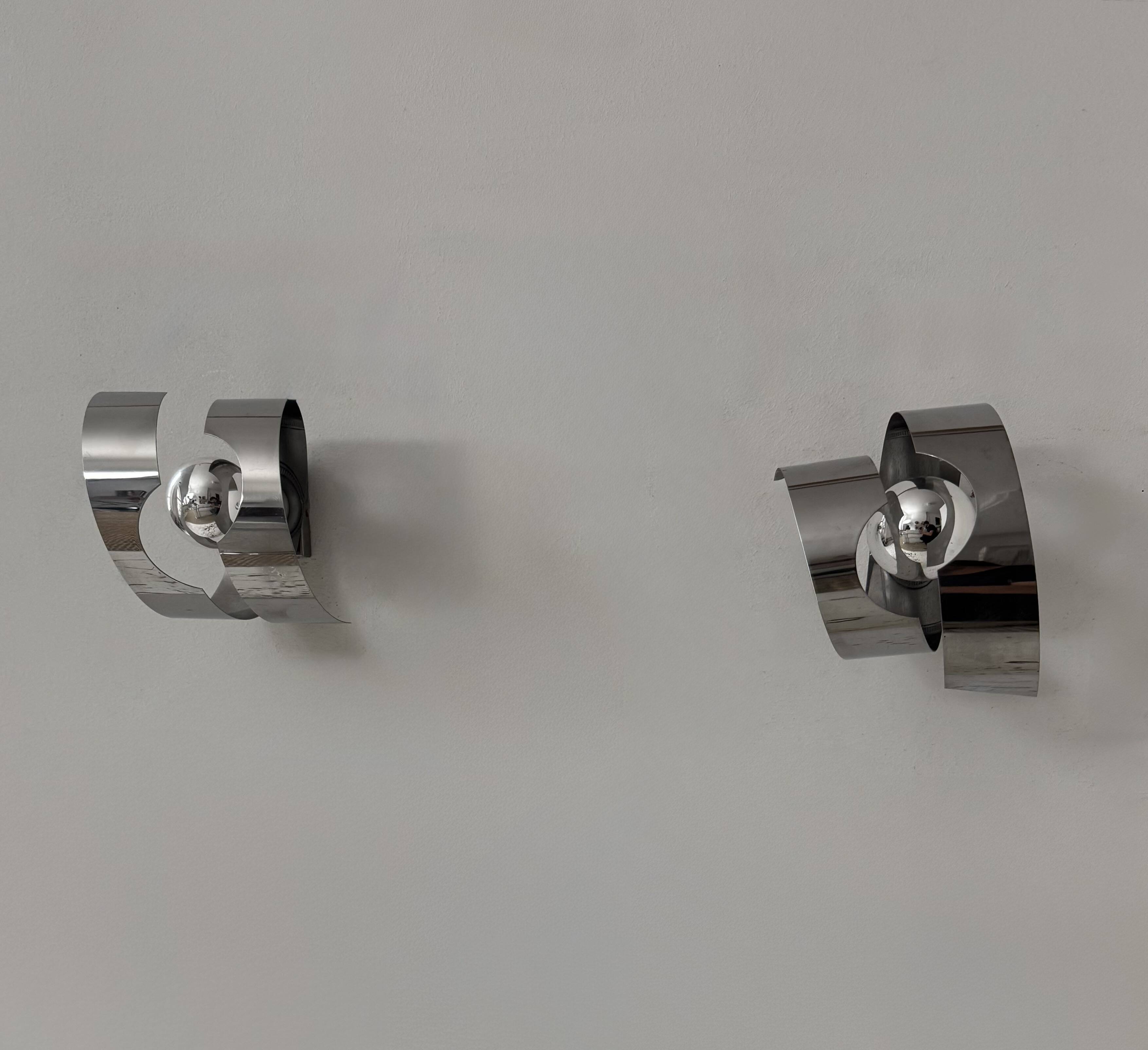Pair of vintage wall sconces, curved chrome-plated metal, France, 1970