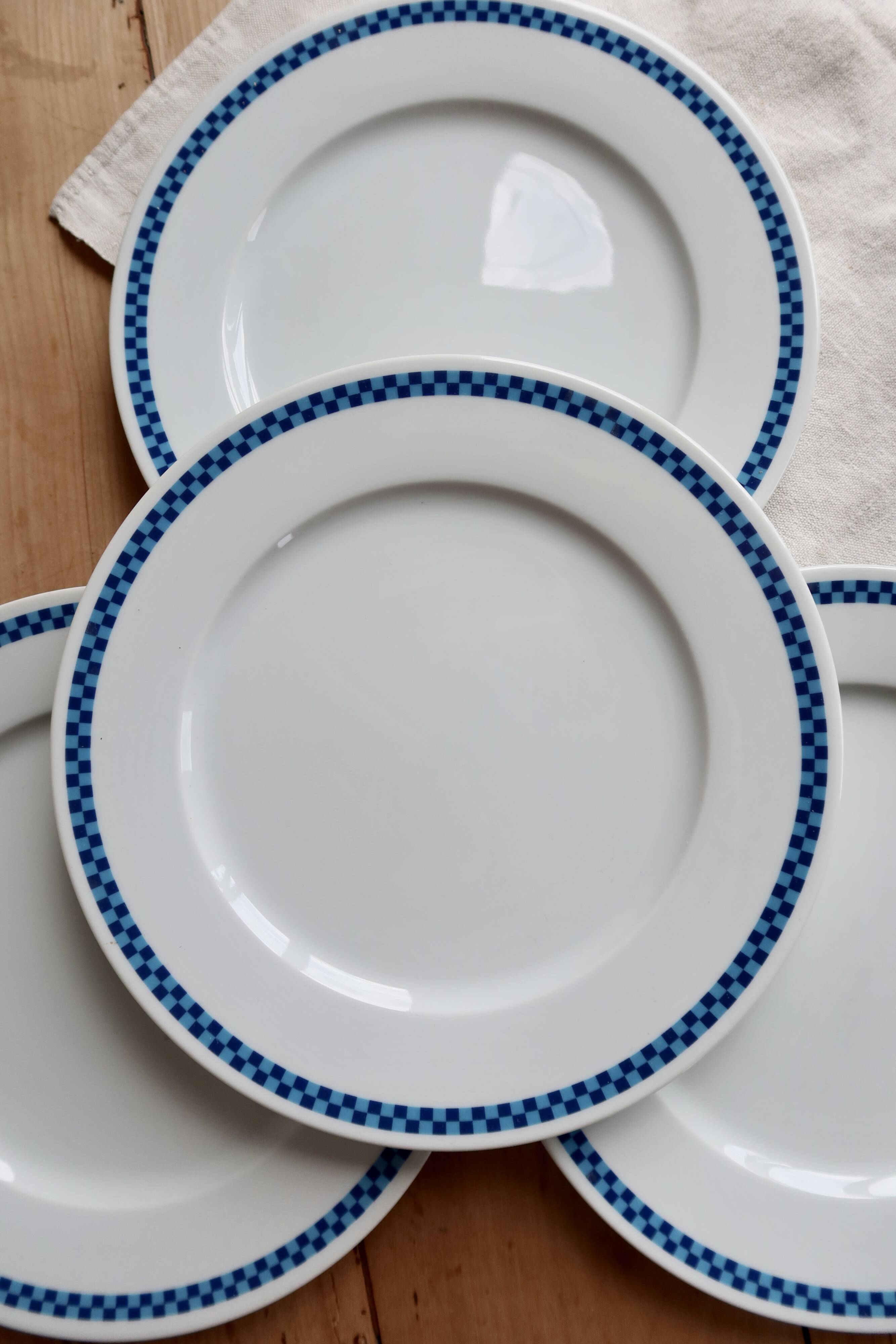 4 vintage Lustucru plates in porcelain with a blue checkered pattern.