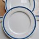 4 vintage Lustucru plates in porcelain with a blue checkered pattern.