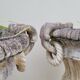 Pair of planter vases decorated with faces in reconstituted stone 1950s