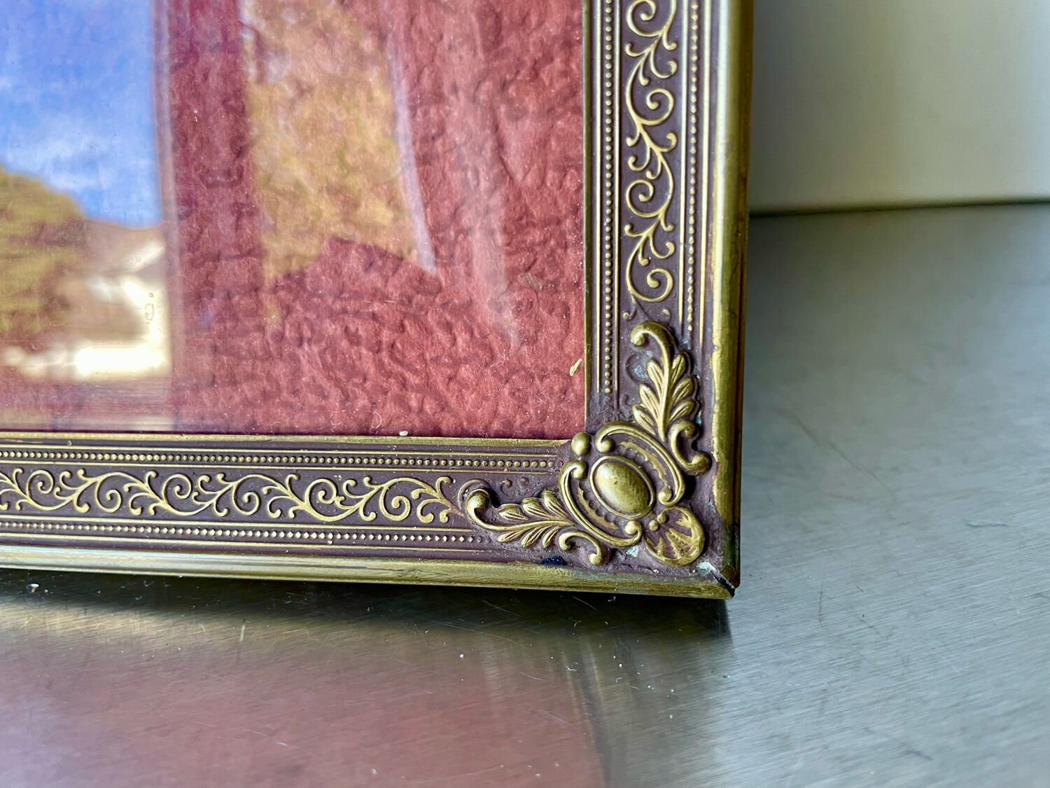 Metal frame in gold colored brass