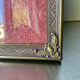 Metal frame in gold colored brass