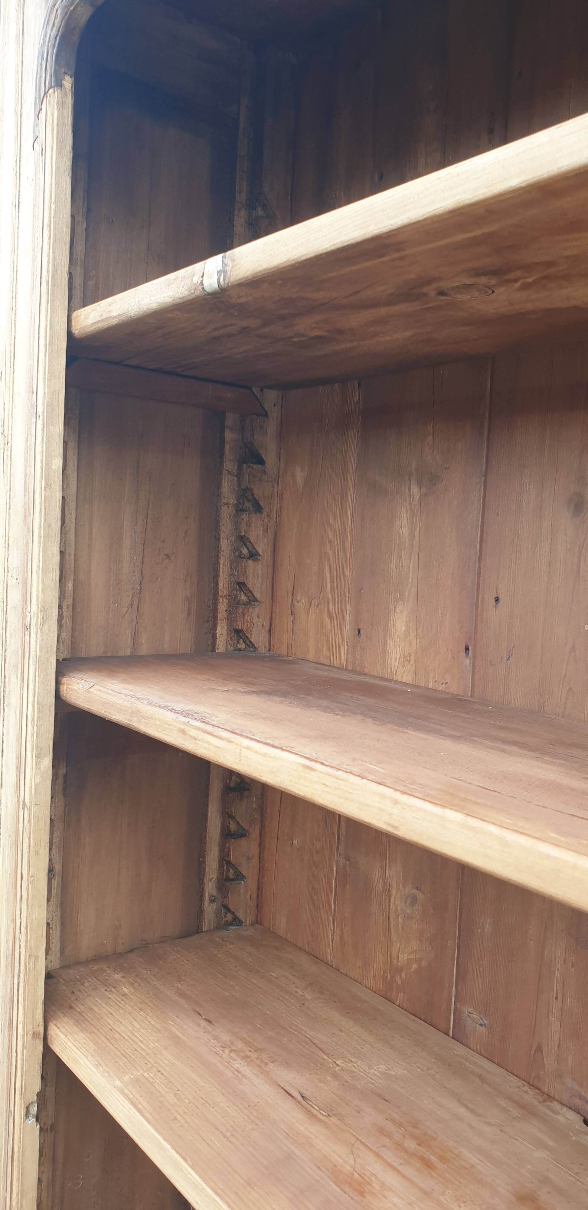 Natural wood bookcase with 3 doors and shelves