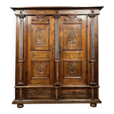 Molded and richly carved wooden cabinet with column decoration