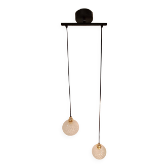 Two-light pendant in a cascade of cut crystal globe