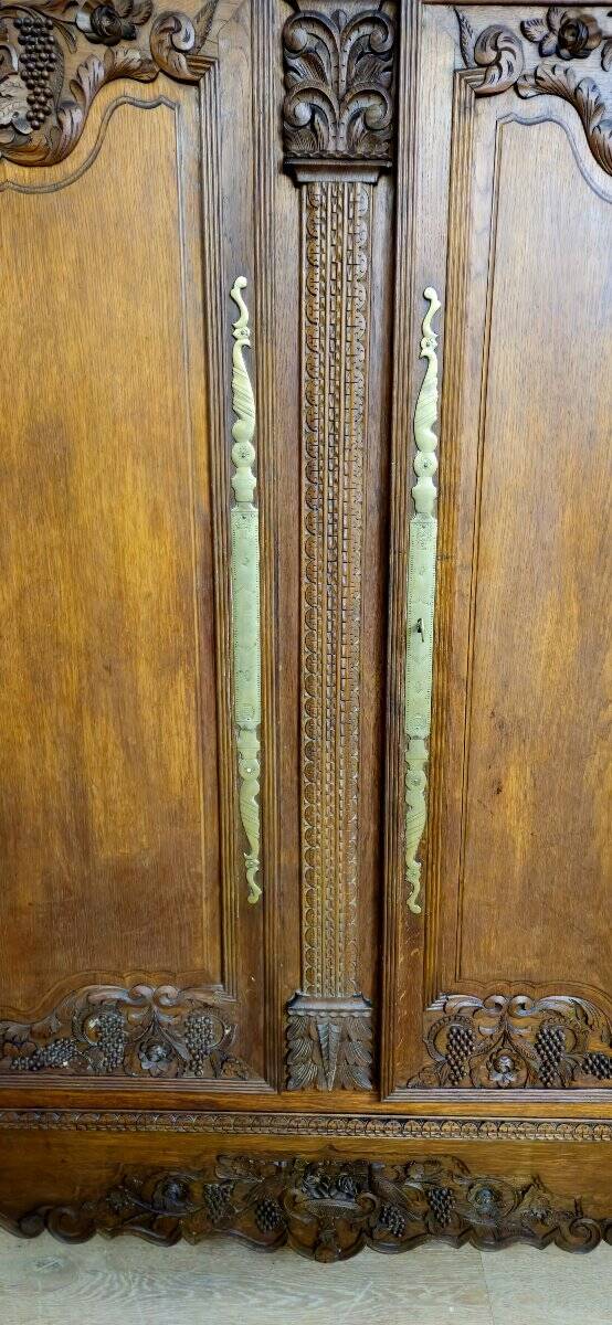 Norman Wedding Armoire in solid oak, richly carved, Louis period.