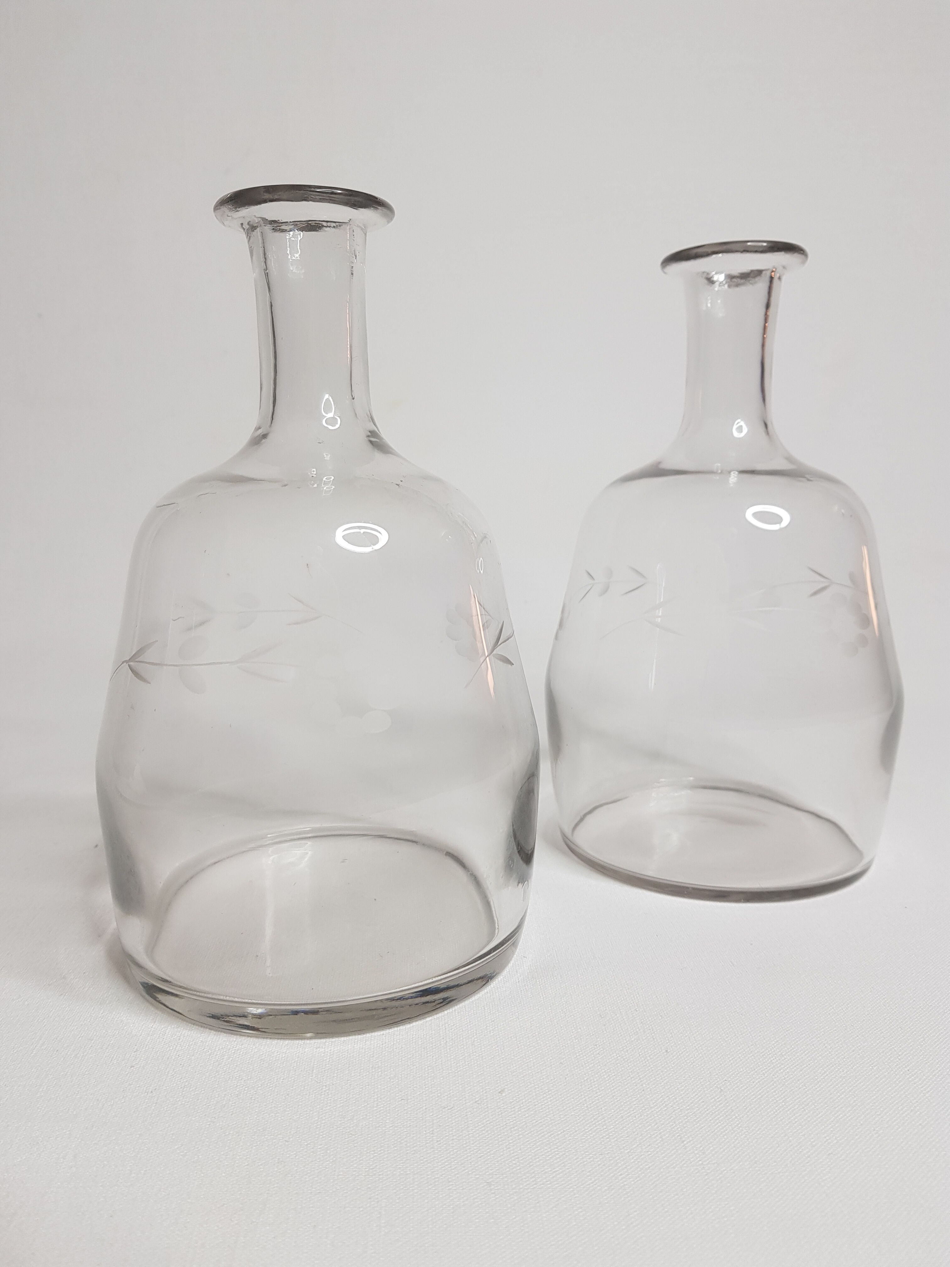 Pair of blown glass decanters and cut with flowers