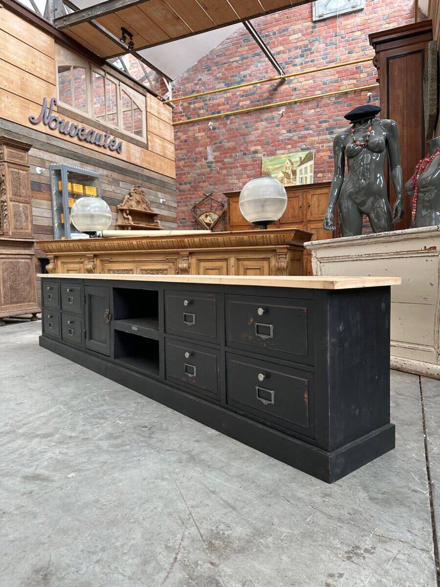Old workshop furniture transformed into a TV unit.