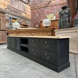 Old workshop furniture transformed into a TV unit.
