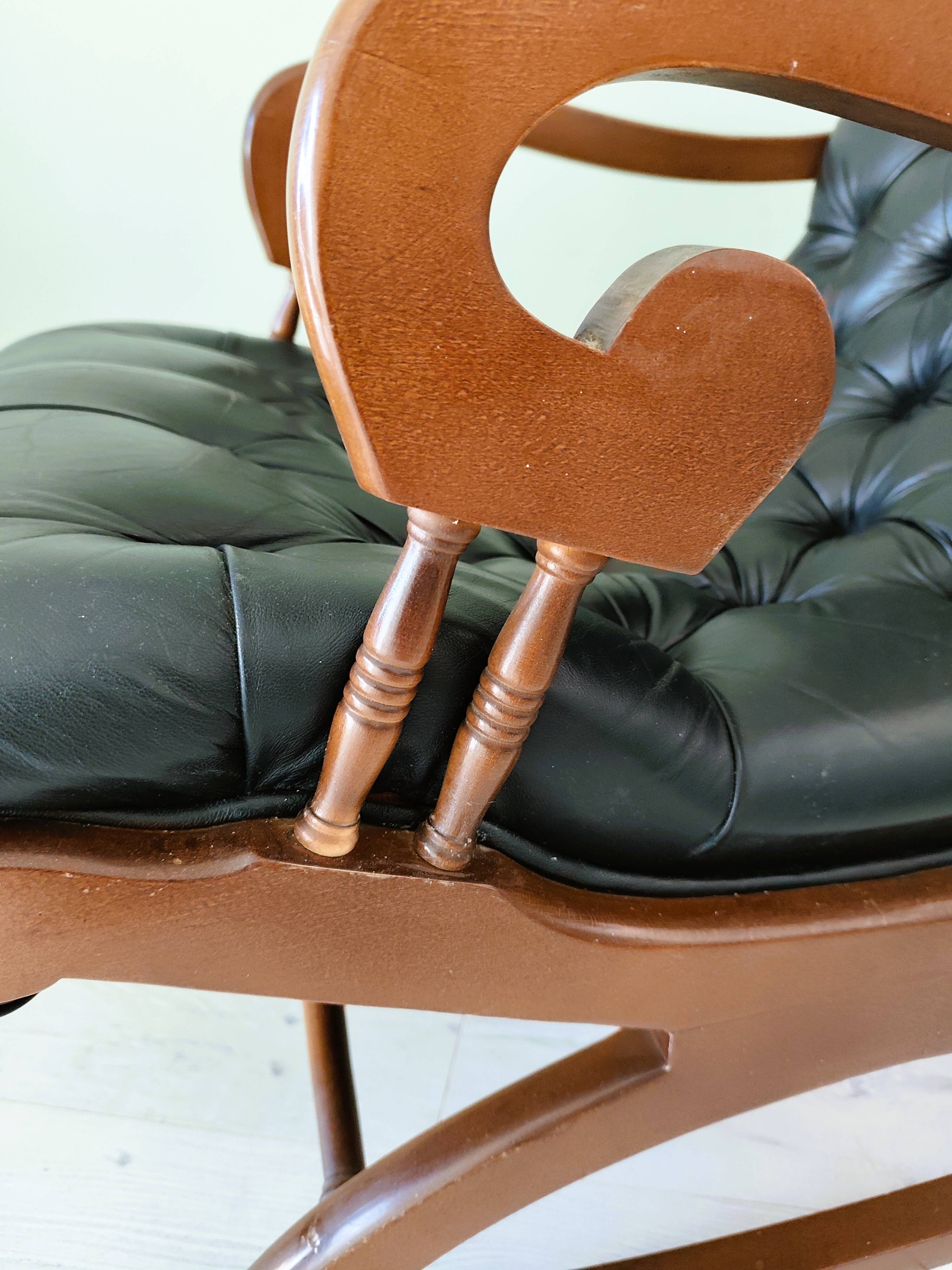 Black leather rocking Chesterfield armchair