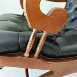 Black leather rocking Chesterfield armchair