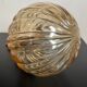 Brass wall light and bubbled glass globe