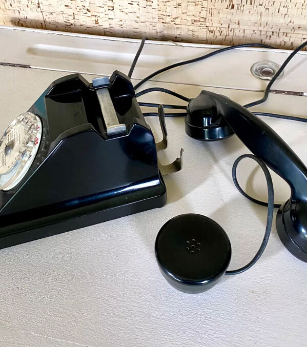 Black Bakelite phone with earphone