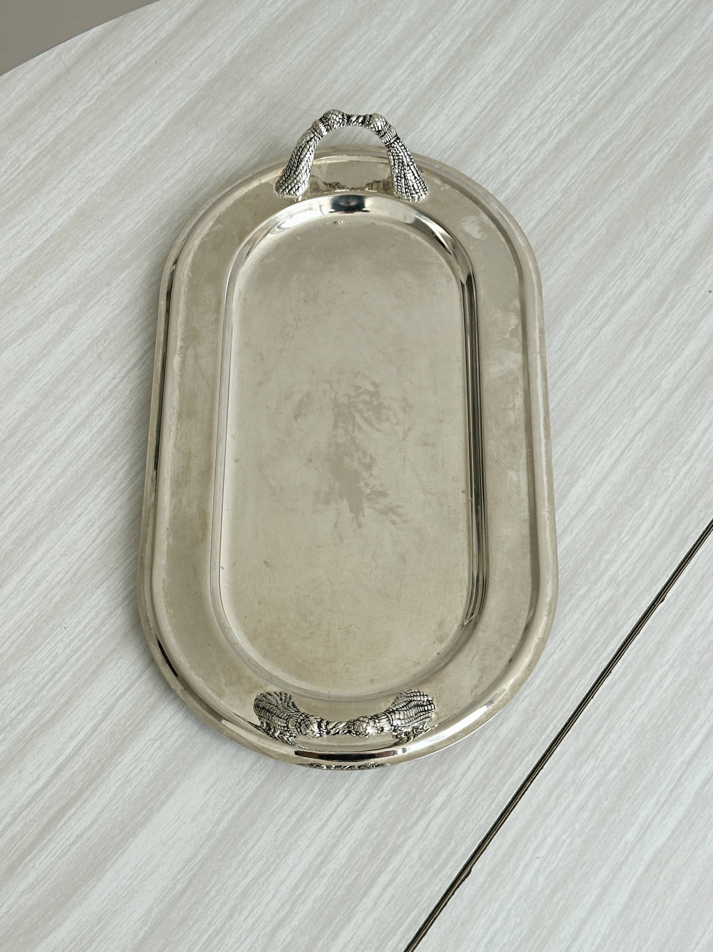 Vintage silver plateau with knot handles.