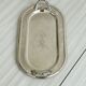 Vintage silver plateau with knot handles.