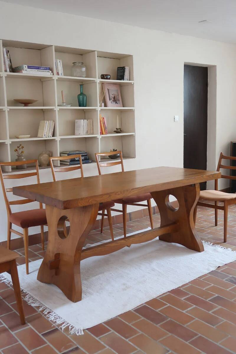 Solid wood dining table, sculpted brutalist base, 1960s.