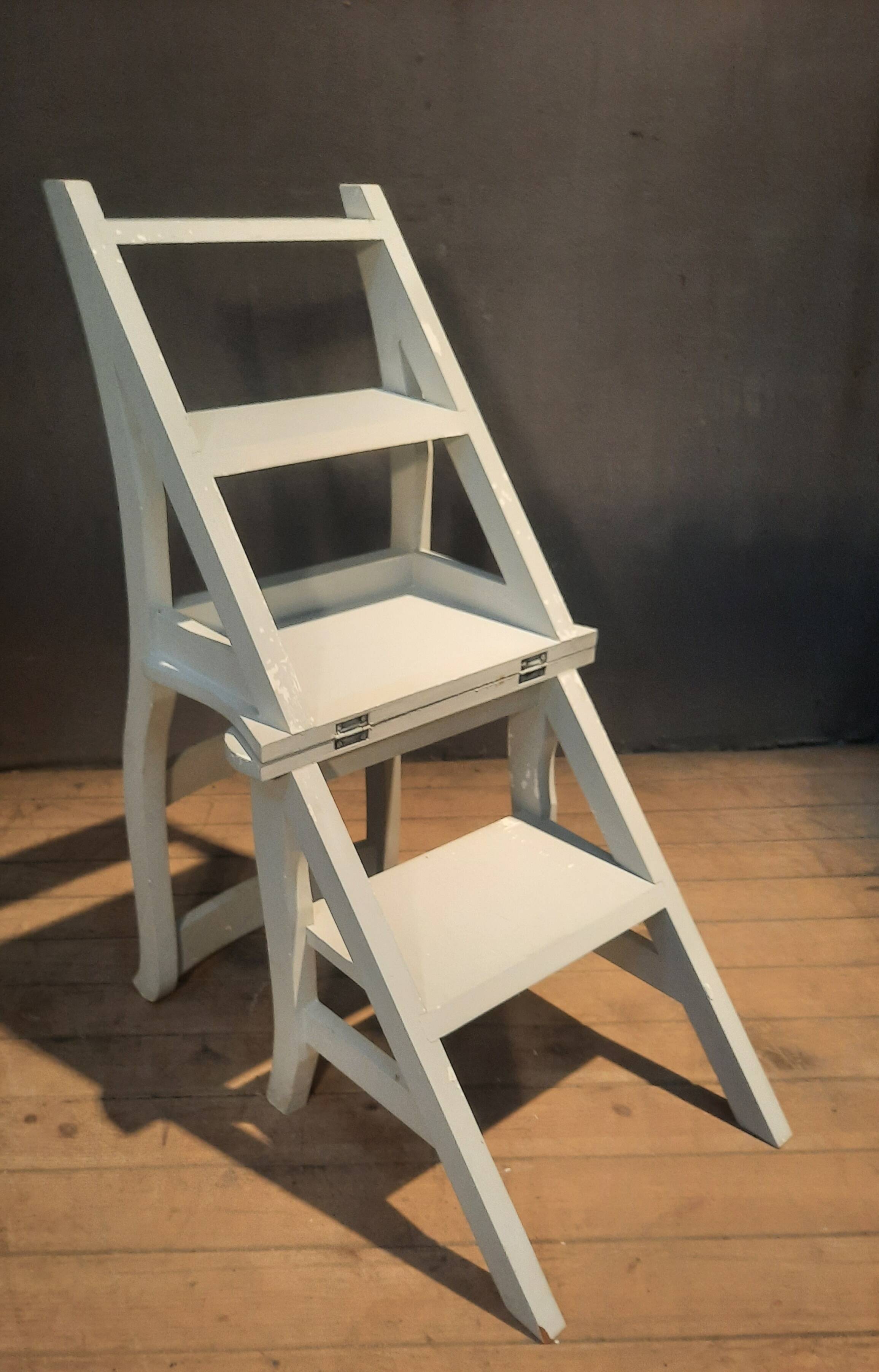 White chair convertible into a staircase.