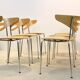 Thonet dining chairs stacked in chrome and beech