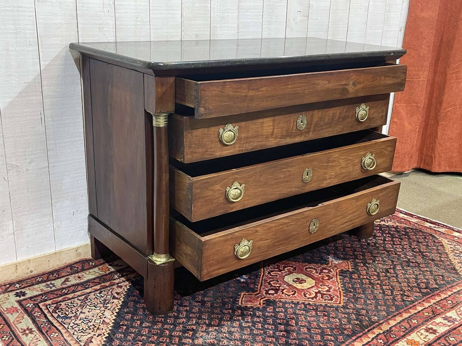 19th century Empire chest of drawers in cherry wood and black marble