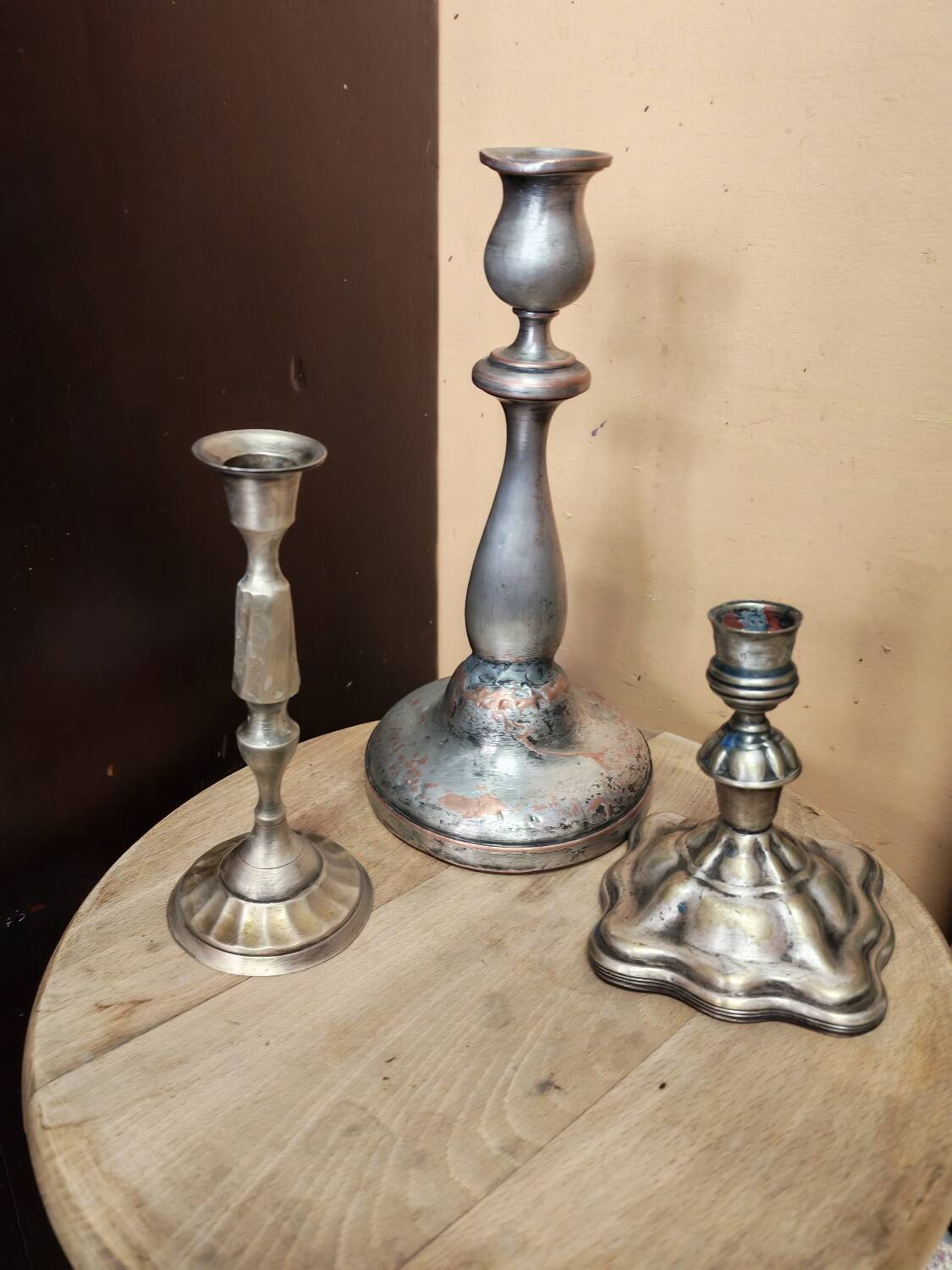 Set of three silver candle holders