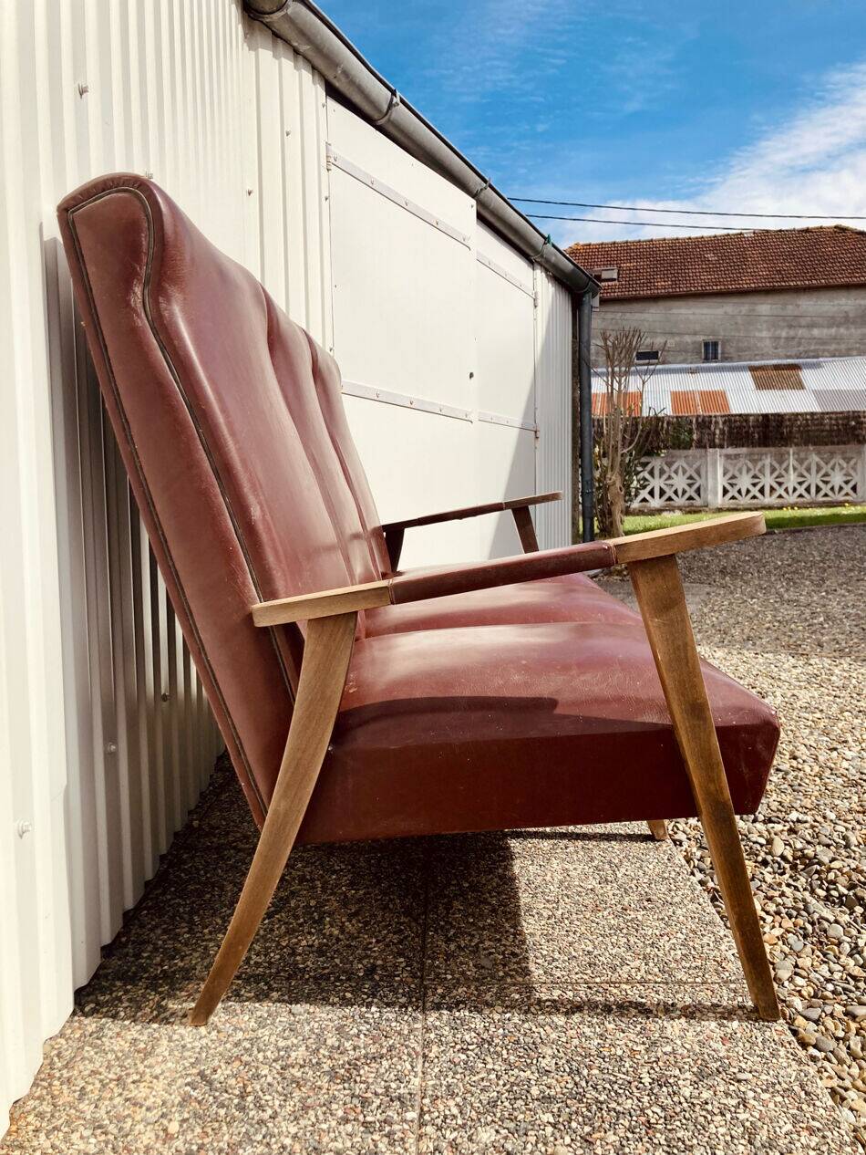 Three-seater patinated leather sofa, mid-century style.