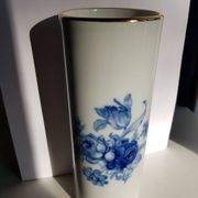 White porcelain vase from Limoges with blue decoration and gold rim.