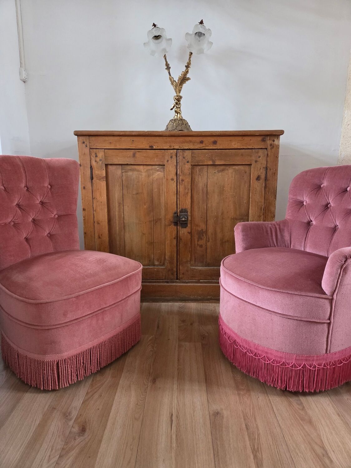 A pair of small tub chairs.