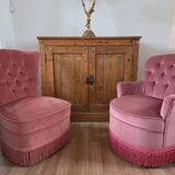 A pair of small tub chairs.