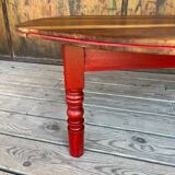 Oval coffee table in wood and red