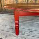 Oval coffee table in wood and red