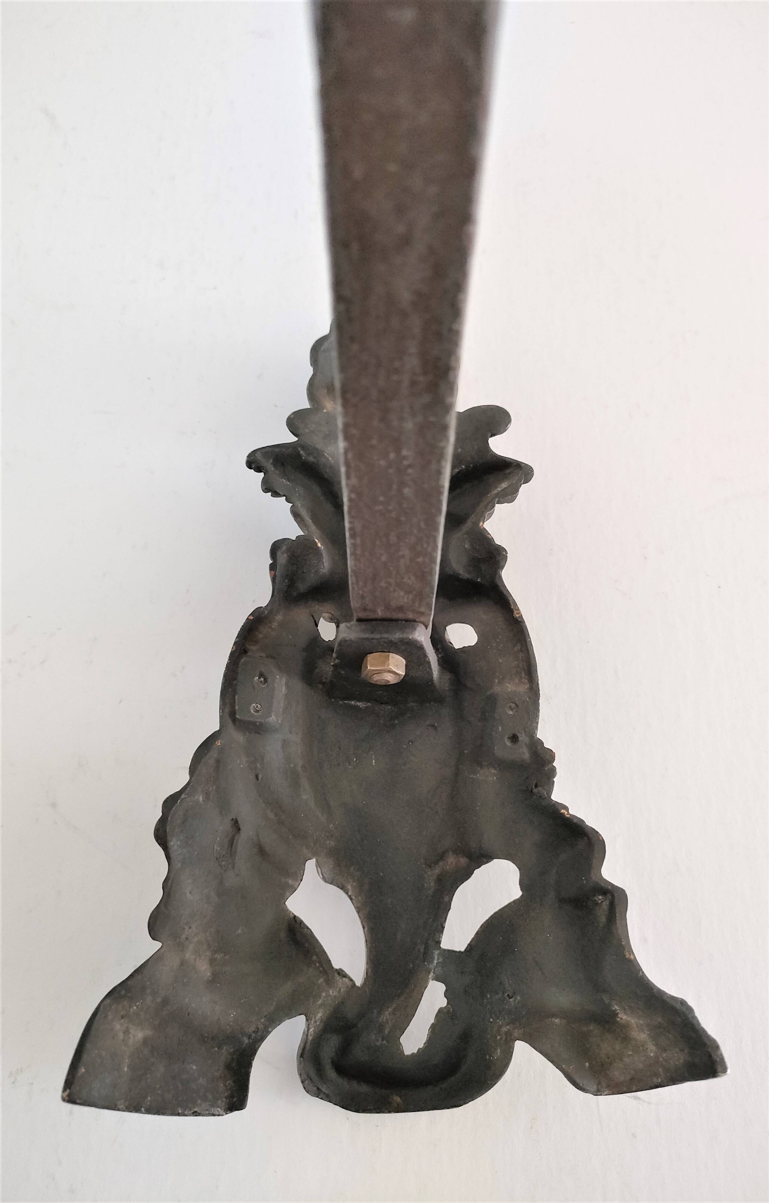 Pair of bronze andirons with black patina, 19th century, female caryatids