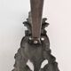 Pair of bronze andirons with black patina, 19th century, female caryatids