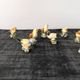 Set of 11 miniature birds in polychrome glazed ceramic.