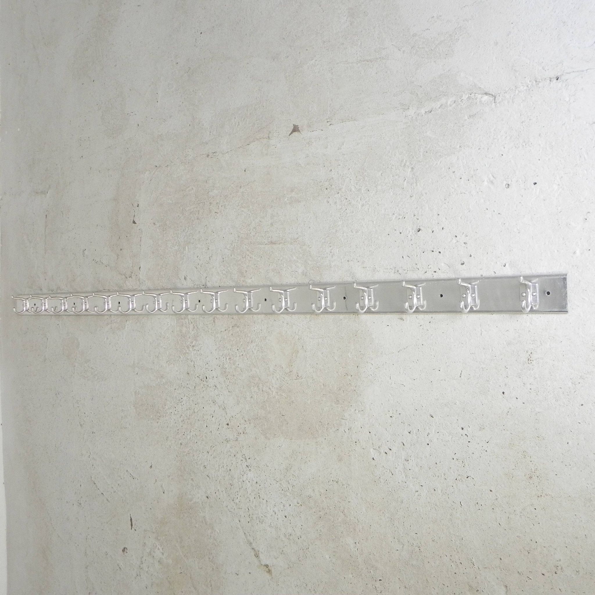 Wall-mounted aluminium coat rack of 225 cm with 16 double hooks, 1960s.
