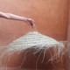 Parasol pendant lamp in braided natural fiber doum straw